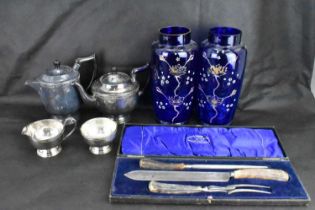 A collectors' lot comprising a cased carving set, a four-piece silver plated tea service, a