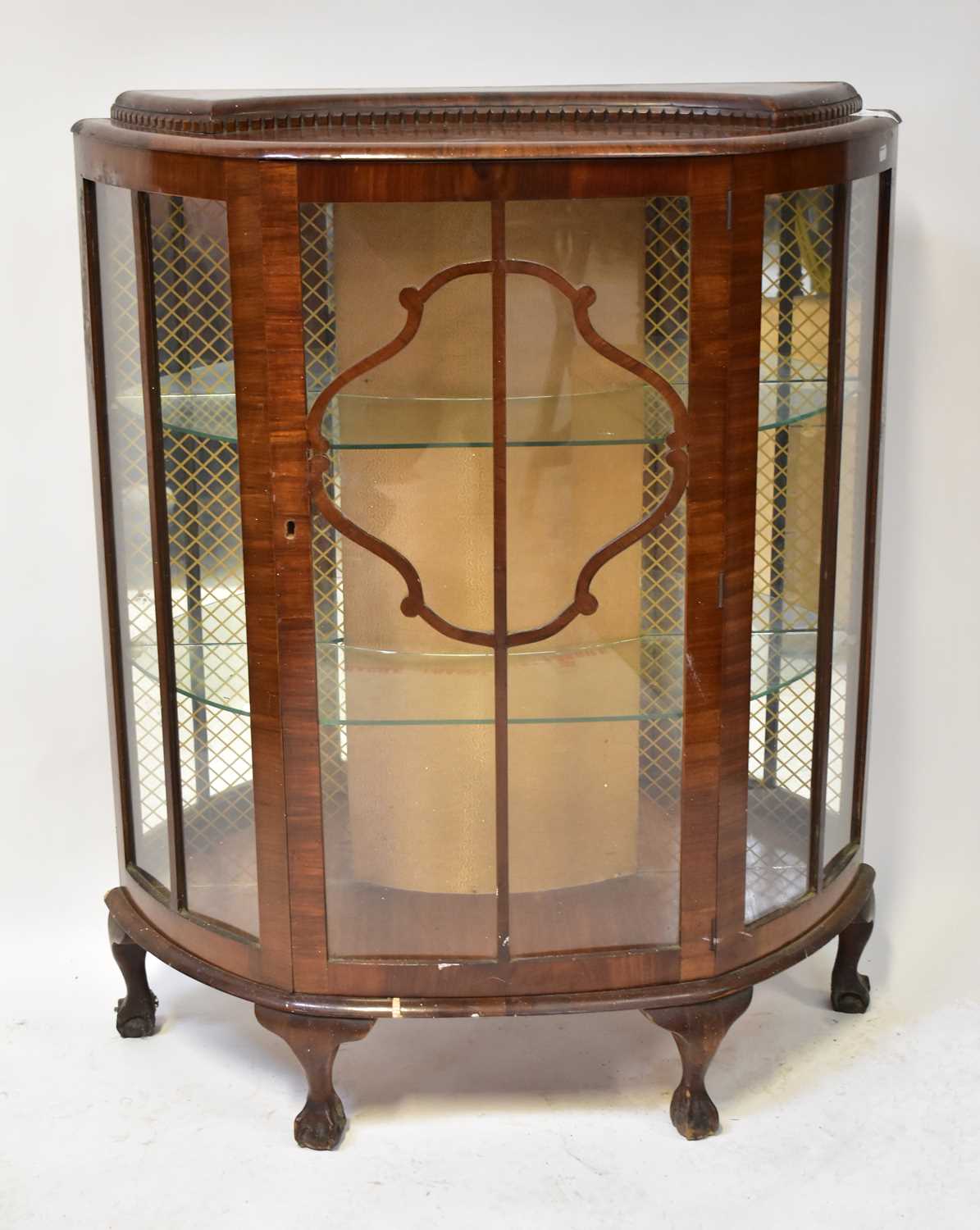 A 1940s walnut bow-fronted display cabinet with shaped top, on cabriole legs, 120 x 98 x 38cm.