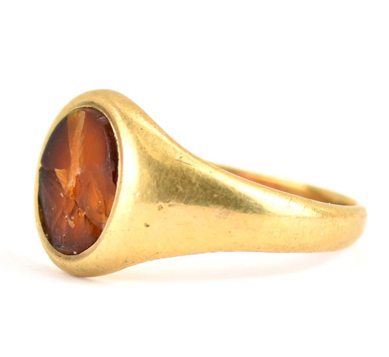 A 9ct gold signet ring with central amber oval, size V, approx. 6.5g. Condition Report: Amber - Image 2 of 4