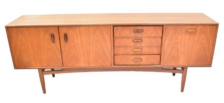 VICTOR WILKINS FOR G-PLAN; a 1960s Brasilia model 4058 teak sideboard, with double cabinet flanked