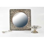 SYNER & BEDDOES; an Edward VII hallmarked silver pierced and repoussé mirror frame, with circular