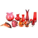 WEDGWOOD; four amber and red glass animal paperweights comprising, squirrel, height 13cm, dolphin,