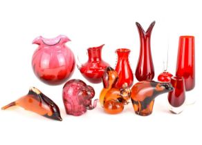 WEDGWOOD; four amber and red glass animal paperweights comprising, squirrel, height 13cm, dolphin,