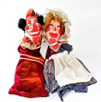 PUNCH AND JUDY; a pair of hand puppets with papier-mâché heads, Punch in burgundy and maroon with