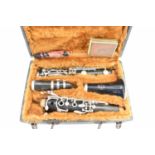 KING LEMAIRE, PARIS; a clarinet in hard carry case. Condition Report: Looks to be in good condition,
