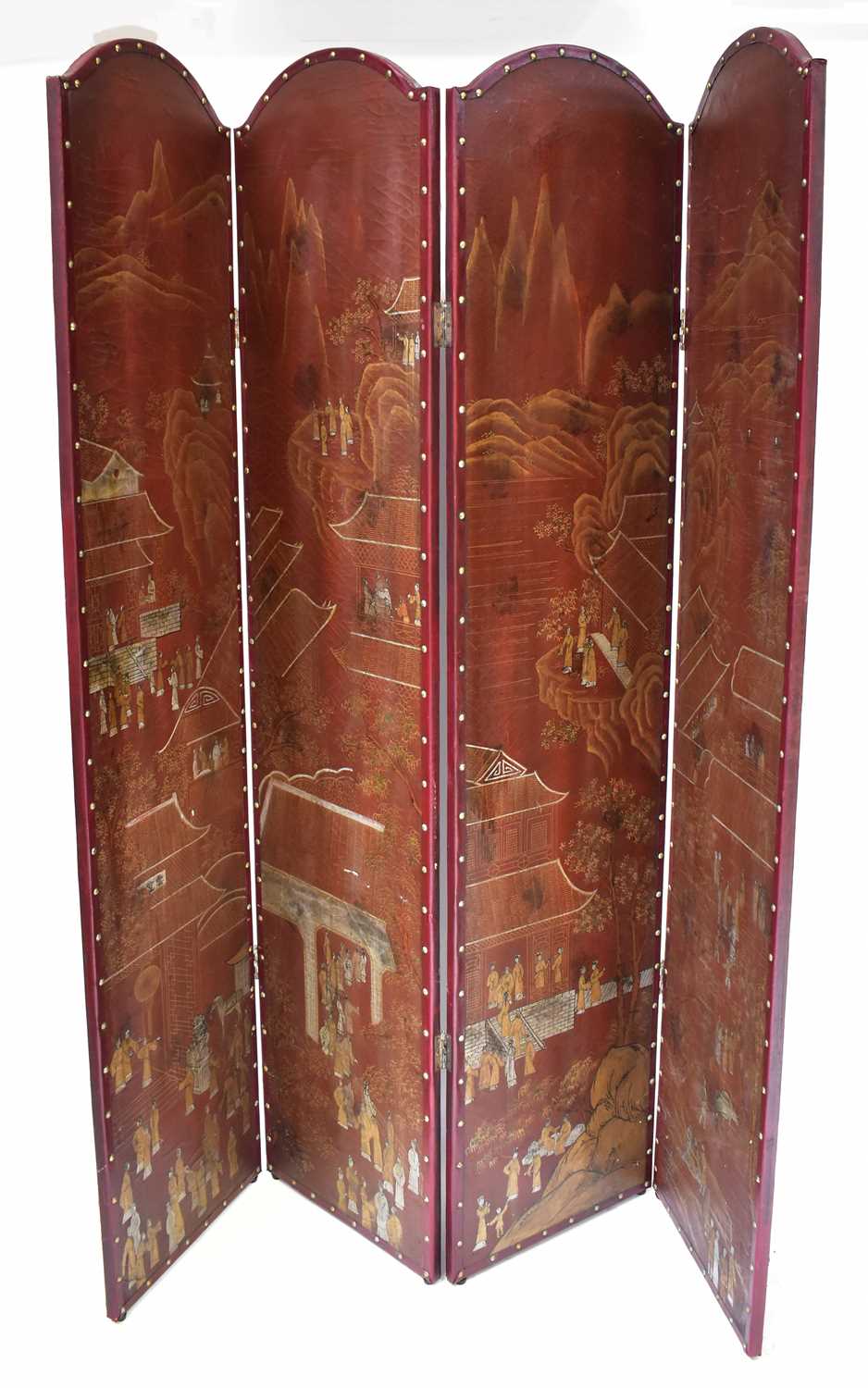 An Oriental-style four-panel screen decorated with gilt-heightened images of a village with