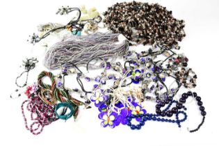 A large quantity of costume jewellery to include necklaces, etc.