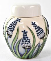 MOORCROFT; a jar and cover in the 'Muscari' design, copyrighted for 2004, with impressed and painted