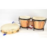 A pair of Bongoset bongos, 18 x 20cm, and a tambourine, diameter 25cm.