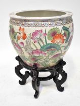 A 20th century Chinese Famille Rose jardinière or fishbowl painted with koi amongst weeds to the