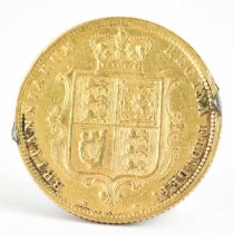 A Victorian 1884 half sovereign, young head, shield back. Condition Report: At two opposing sides on