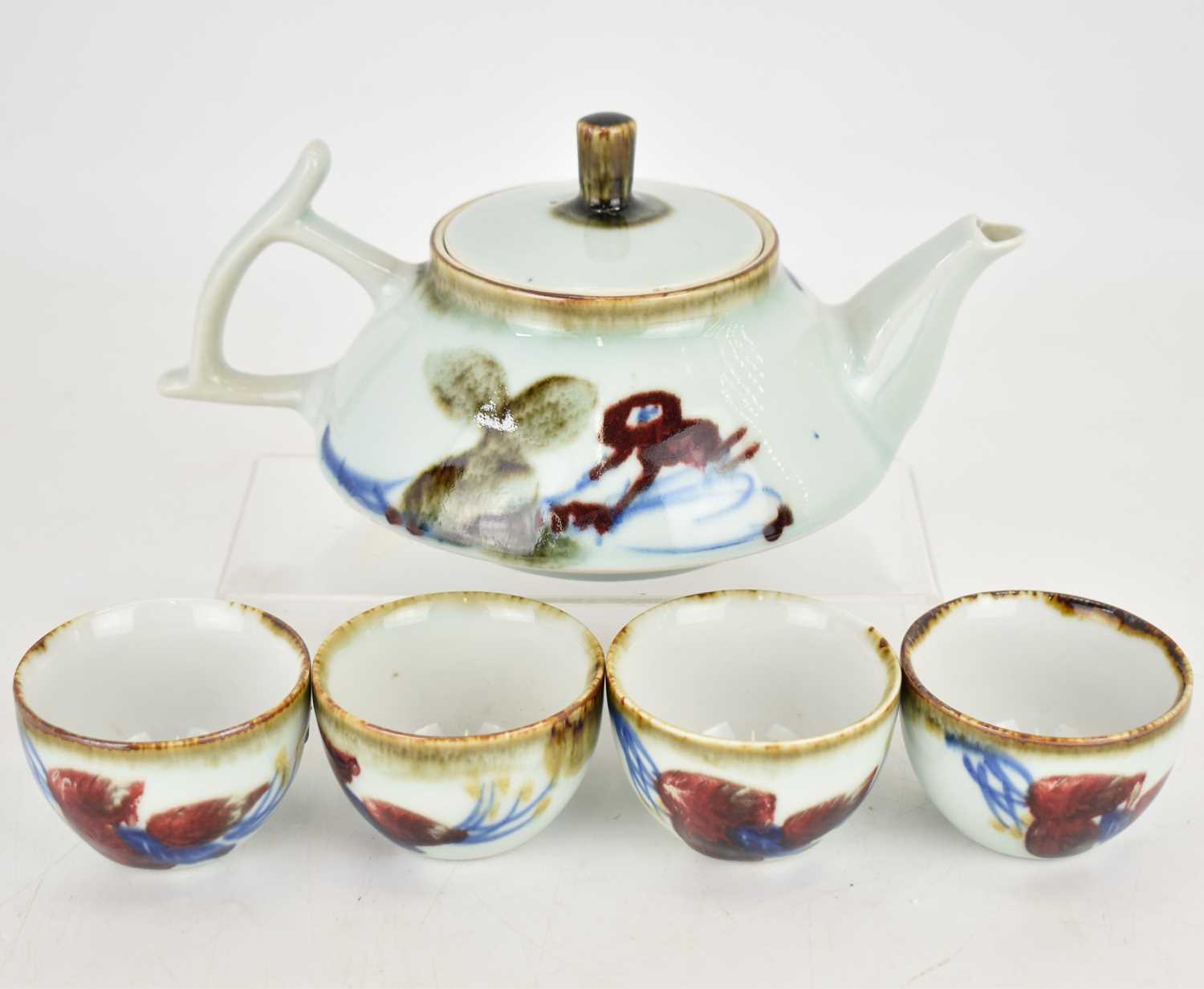 A modern Japanese sake teapot, 12 x 22cm, and four tea bowls, 4.5 x 7cm, marked to the underside - Image 2 of 3