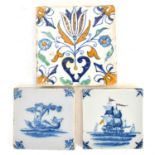 Three 18th century tin glazed tiles comprising a large polychrome decorated tulip and floral pattern