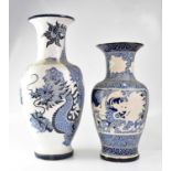 A large 20th century Chinese blue and white vase of baluster form, incised with writhing dragons,