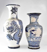 A large 20th century Chinese blue and white vase of baluster form, incised with writhing dragons,