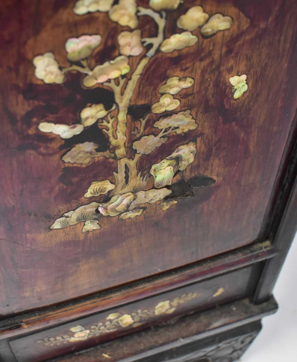 An early 20th century Chinese stained hardwood mother of pearl inlaid side cabinet, with carved - Image 3 of 3