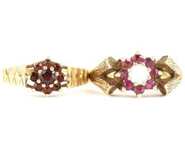Two 1970s 9ct gold ruby cluster rings, one with central claw set white opal, both with textured