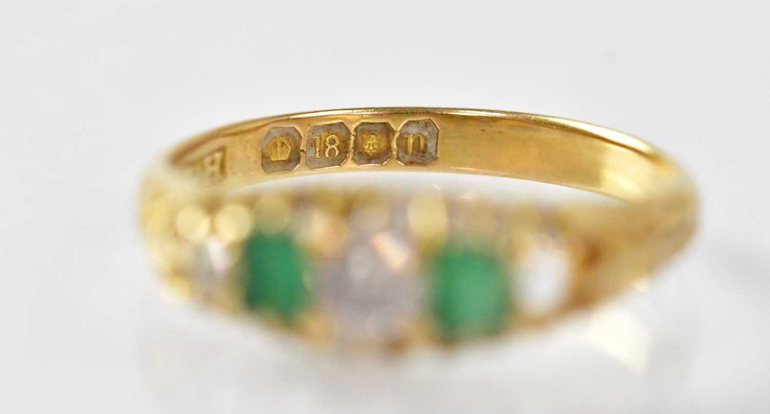 An 18ct gold ring alternately claw set with two emeralds and two diamonds, stamped 18, size N, - Image 2 of 2