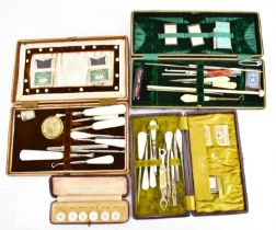 A cased set of six mother of pearl buttons, two cased manicure sets with mother of pearl handles and