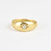An 18ct gold ring with star inset tiny brilliant cut diamond, size P, approx. 4.7g.