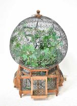 A Chinese-style wire work birdcage of globular form on a wooden frame, height 64cm. Condition