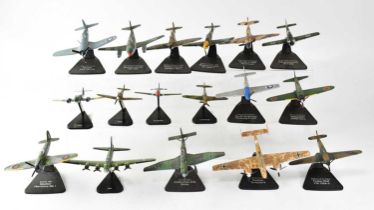 A quantity of painted cast metal scale models of military aircraft on black plastic stands (part