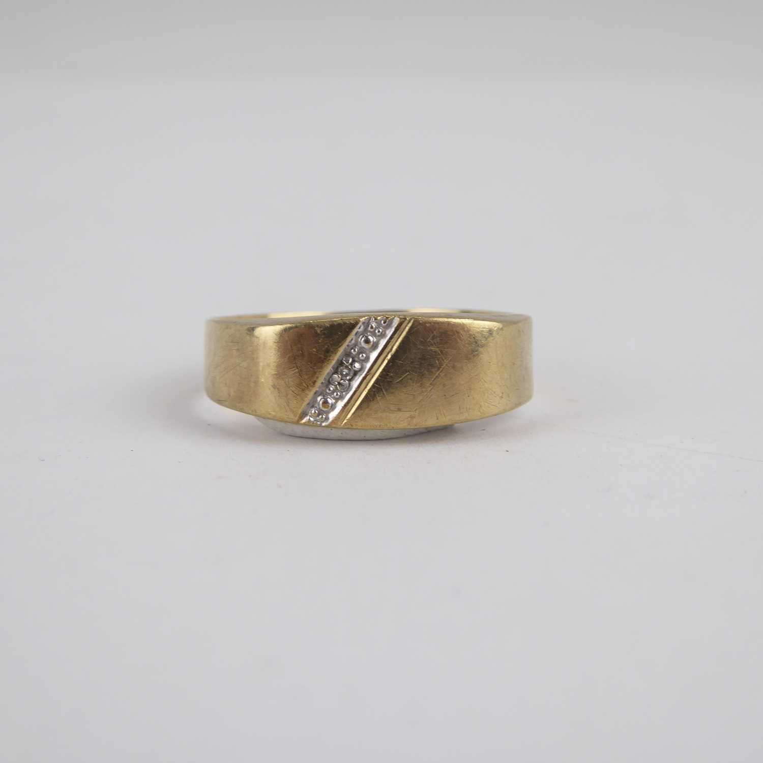 A 9ct gold band ring with flat table and diagonal diamond set line, size X, approx. 2.2g. - Image 2 of 4