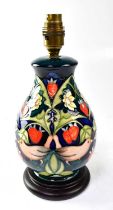 MOORCROFT; a lamp in the 'Strawberry Thief' pattern, on a circular wooden base, height including