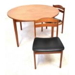 A mid-20th century Danish teak circular extending dining table with one integral leaf, on circular