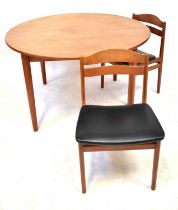 A mid-20th century Danish teak circular extending dining table with one integral leaf, on circular