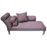 An Edwardian mahogany chaise longue upholstered in a green and maroon tartan fabric, on turned