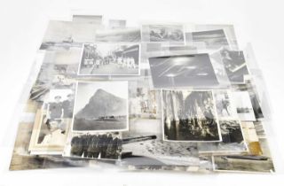 A WWII period collection of approximately seventy black and white photographs from the latter part