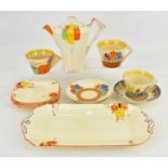 Various Art Deco ceramics comprising a Clarice Cliff 'Crocus' pattern teacup with triangular handle,