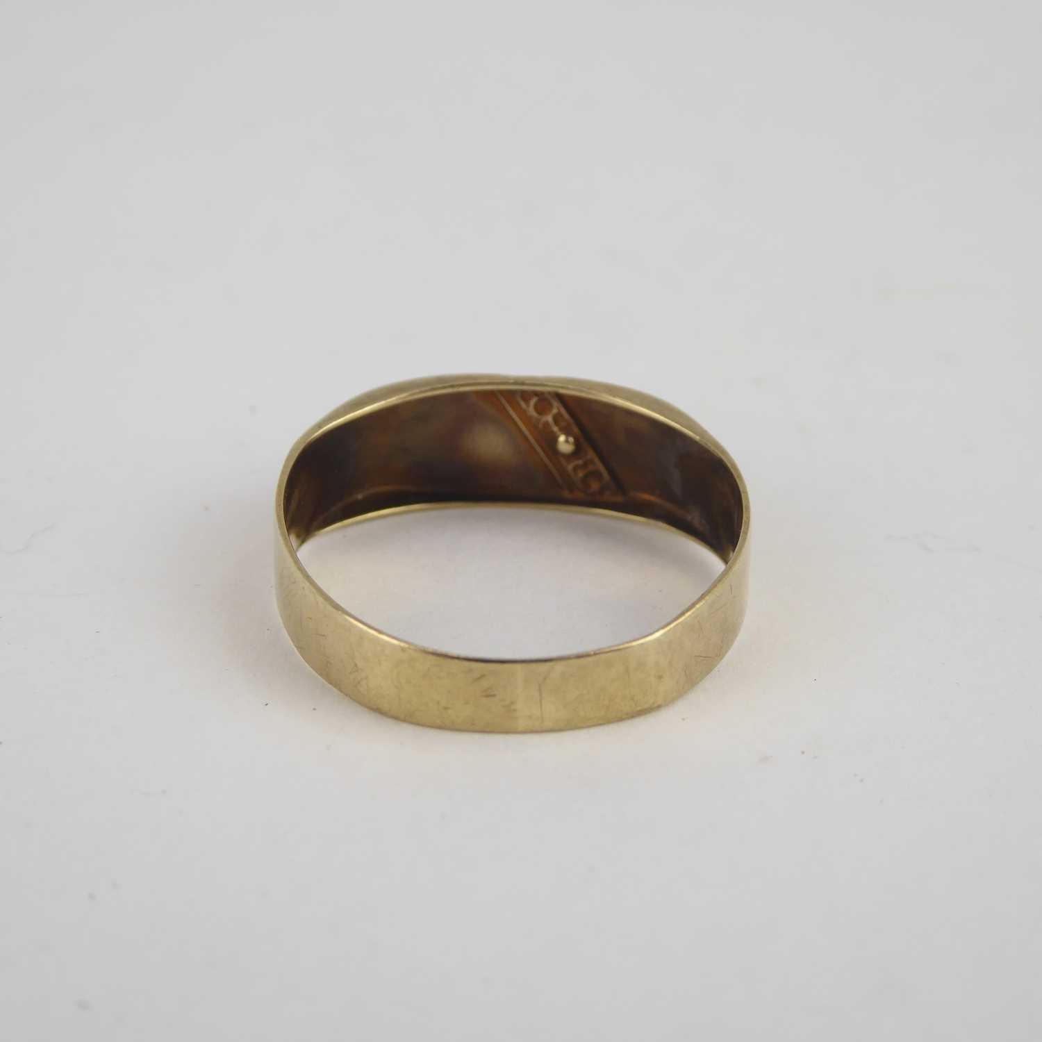 A 9ct gold band ring with flat table and diagonal diamond set line, size X, approx. 2.2g. - Image 4 of 4