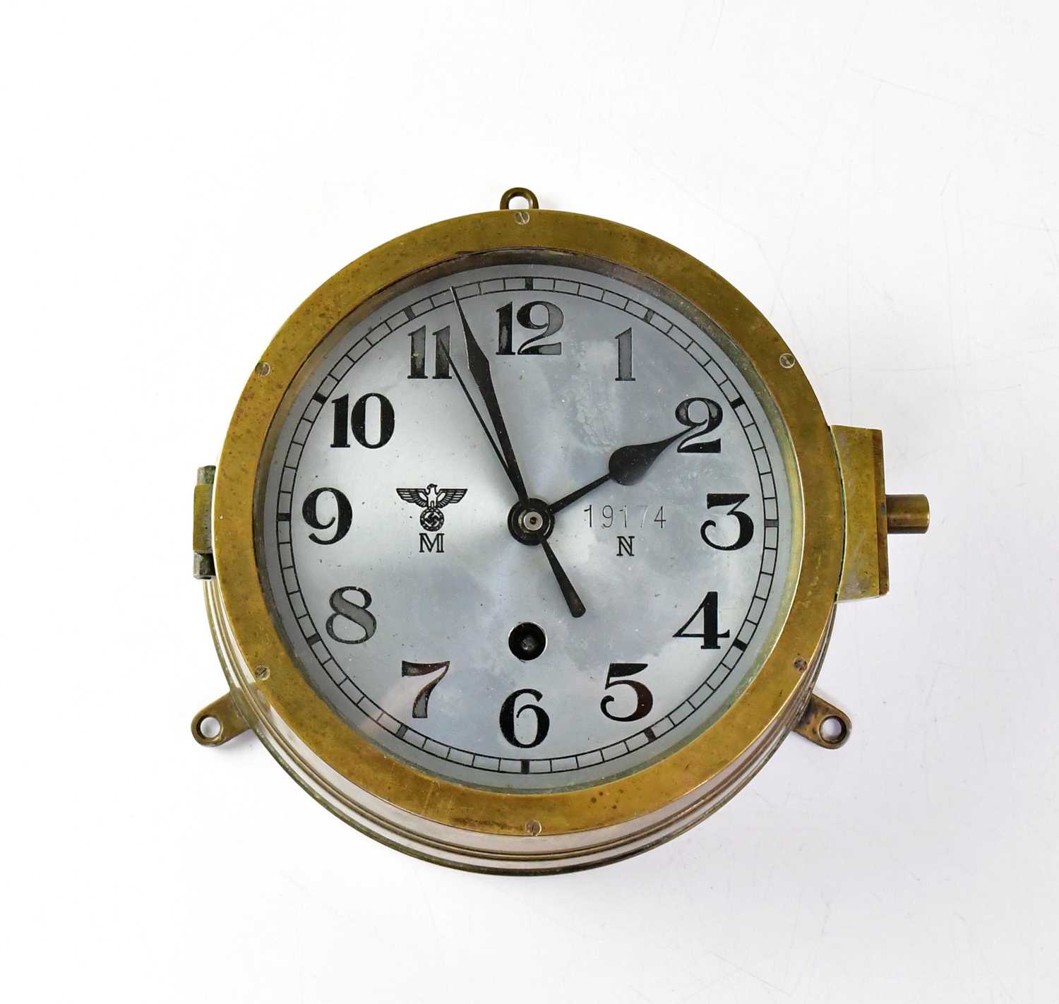 A WWII German Kriegsmarine U-Boat brass cased bulkhead clock, the 16cm silvered dial set with Arabic