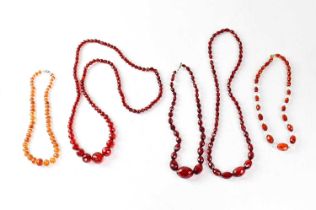 Three sets of cherry amber style facet cut beads, together with two tawny amber style facet cut bead