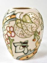 MOORCROFT; a small vase in the 'Golden Lily Ivory' design, copyrighted for 1993, with impressed