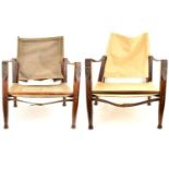 KAARE KLINT, DENMARK; a pair of ash and canvas safari chairs, marked 'Denmark 25160' to back