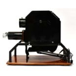An epidiascope projector mounted on a wooden base, the lens inscribed 'Newton London 16"