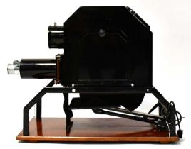 An epidiascope projector mounted on a wooden base, the lens inscribed 'Newton London 16"