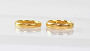 Two 22ct gold wedding bands, size L and J1/2, combined approx. 10g (2).