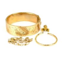 A small gold necklace pendant, a single gold hoop earring (af), a gold hinged bracelet (af), and a