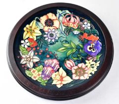 MOORCROFT; a Centenary Year charger in the 'Carousel' design, copyrighted for 1996, signed R. J.