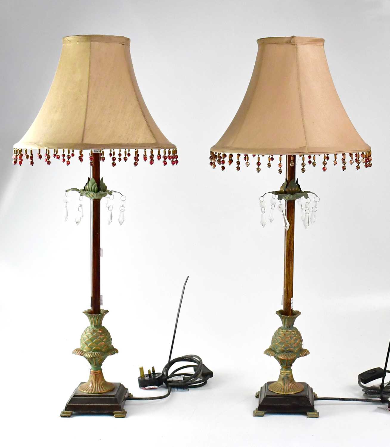 A pair of metal table lamps with columns in the form of palm trees, to lion paw feet, together