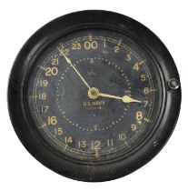 An American Navy 24-hour ship's clock in a Bakelite case, the face numbered 11643-E, diameter 20cm.