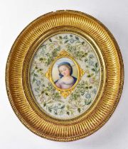 A 19th century Berlin ceramic plaque painted with a head and shoulders portrait of the Madonna, oval
