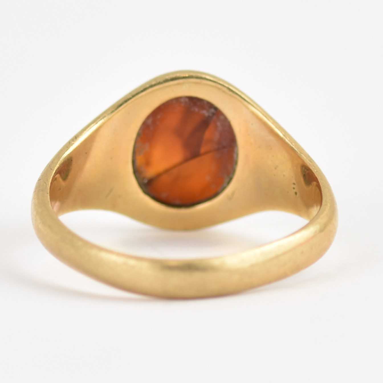 A 9ct gold signet ring with central amber oval, size V, approx. 6.5g. Condition Report: Amber - Image 3 of 4