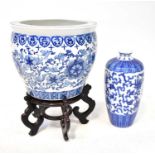 A 20th century Chinese blue and white jardinière or carp bowl painted with scrolling flower motif,