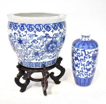 A 20th century Chinese blue and white jardinière or carp bowl painted with scrolling flower motif,