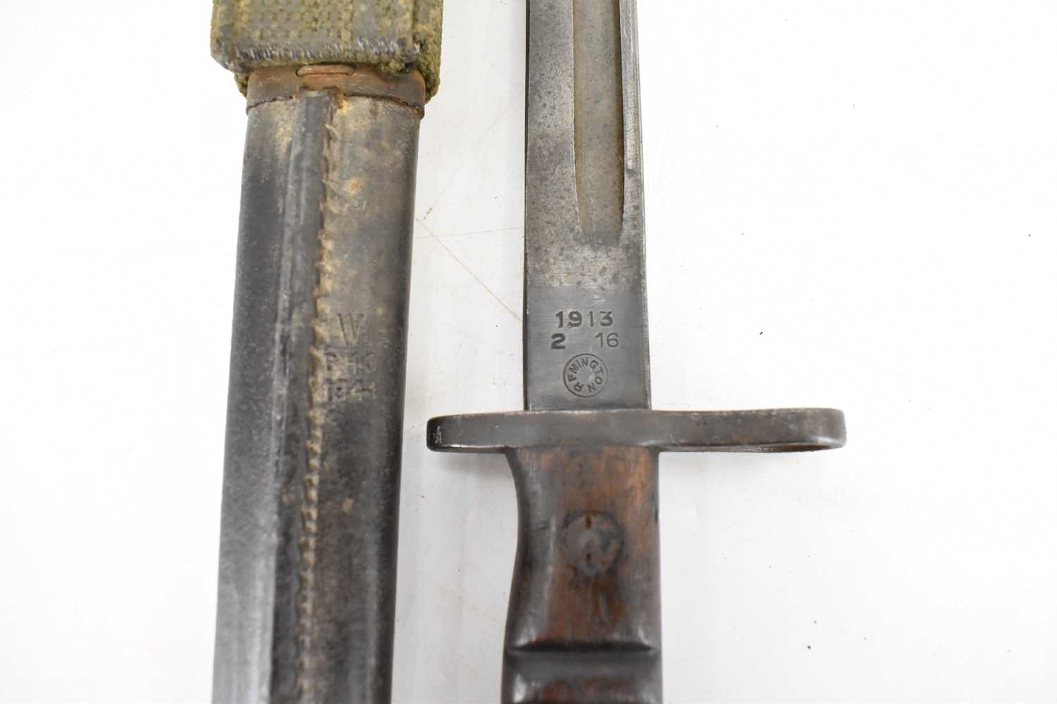 REMMINGTON; a WWI 1913 pattern bayonet, dated 16/2/1913, with relevant markings and leather - Image 9 of 12